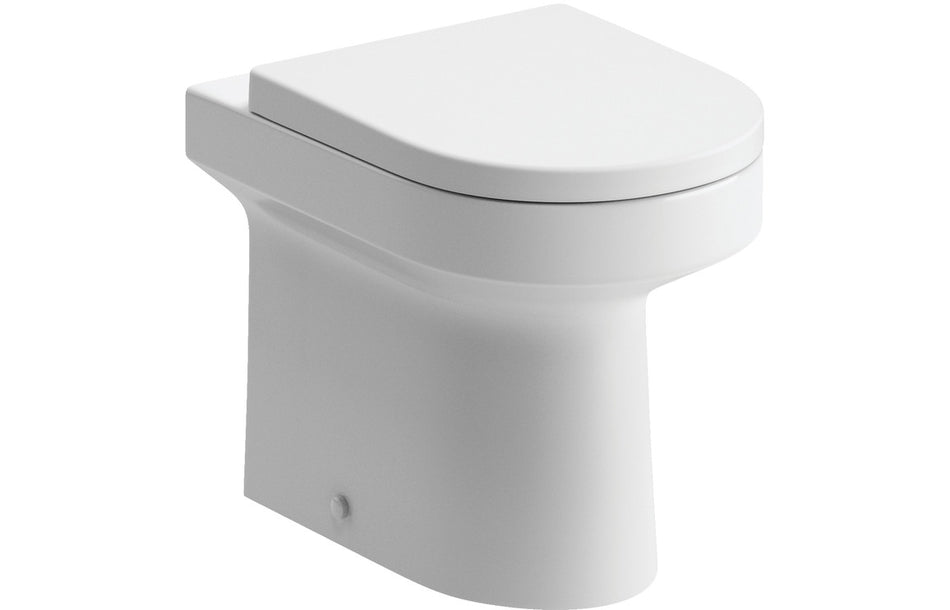 White closed toilet seat on toilet bowl