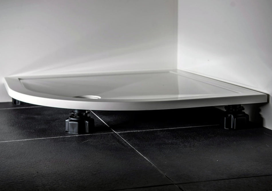 Shower tray riser kit with white tray and black adjustable leveling feet